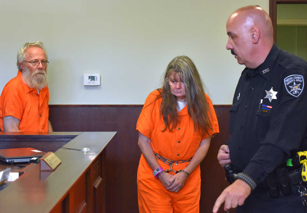 Bruce Leornard, left, and Deborah Leonard, center, enter the courtroom of before their arraignment, Tuesday, Oct. 13, 2015 in New Hartford, N.Y. The central New York couple have been charged with fatally beating their 19-year-old son inside a church, and four fellow church members have been charged with assault in an attack that also left the young man's brother severely injured, police said Tuesday.  (Mark DiOrio/Observer-Dispatch via AP)  ROME OUT; MANDATORY CREDIT