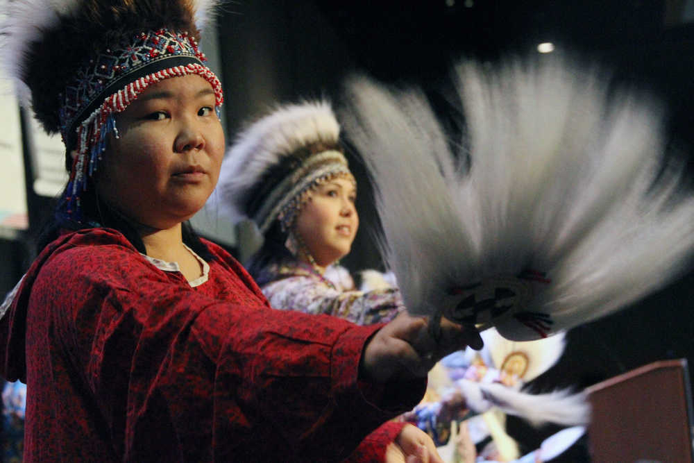 Riannon Watson, of Anchorage, Alaska, performs with the Acilquq Drummers and Dancers during the annual Alaska Federation of Natives conference in Anchorage, Alaska, Thursday, Oct. 15, 2015. The convention is annually the largest gathering of Alaska Natives in the state every year.  (AP Photo/Mark Thiessen)