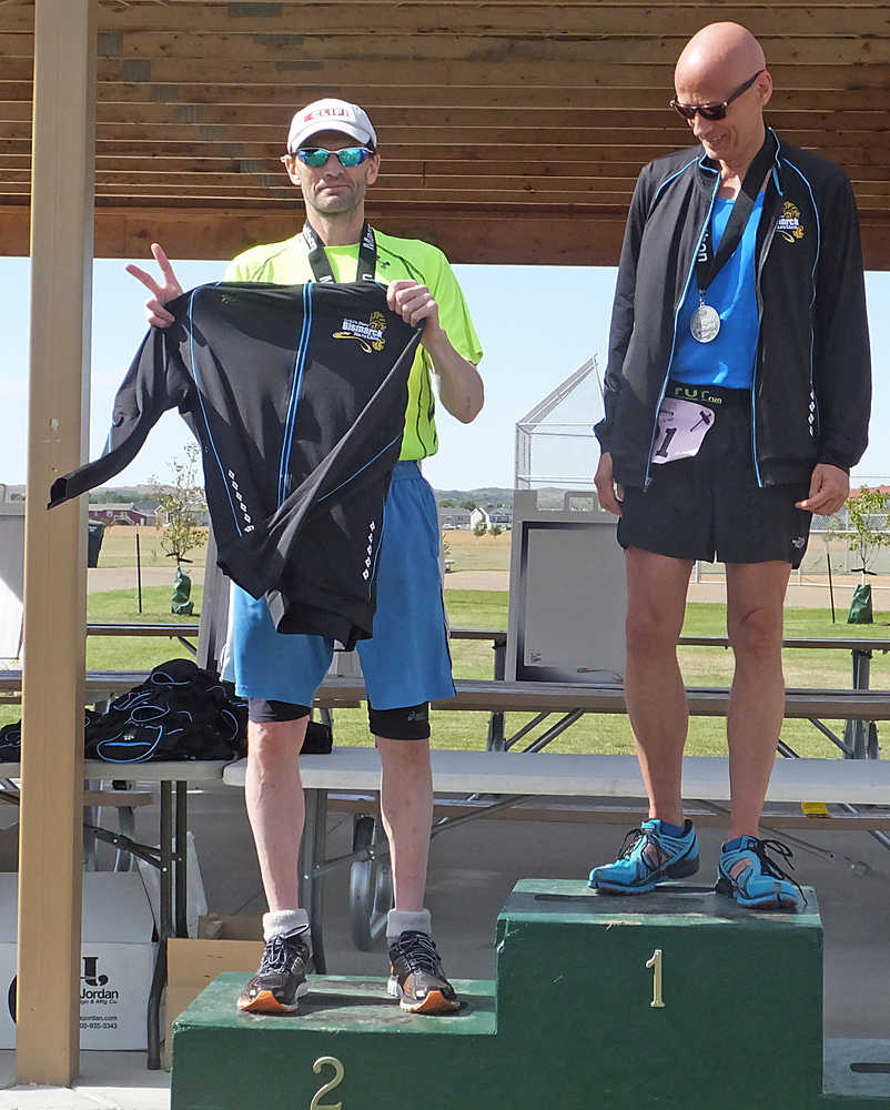 Posing with my swag from the Bismarck Marathon. Yep. Number 2... but I try harder.