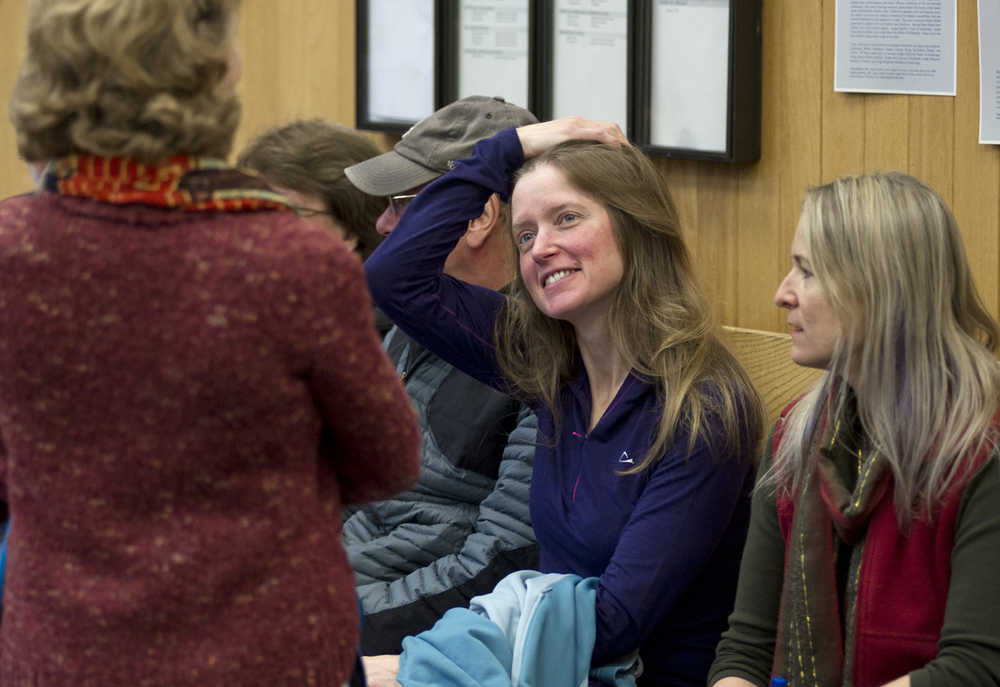 Kathleen Turley, second from right, waits with supporters for the Juneau District Court to open for a lawsuit against her by trapper John Forrest for interfering with his traps on the Davies Creek Trail in December.