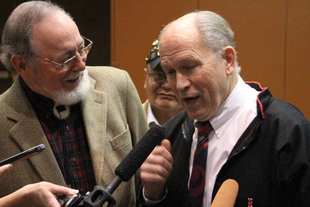 U.S. Rep. Don Young, R-Alaska,, left, listens as Alaska Gov. Bill Walker speaks to reporters at the Alaska Federation of Natives conference in Anchorage, Alaska, on Friday, Oct. 16, 2015. The men spoke after Interior Secretary Sally Jewell said her agency was canceling future lease sales and will not extend current drilling leases in Arctic waters off Alaska's northern coast. (AP Photo/Mark Thiessen)