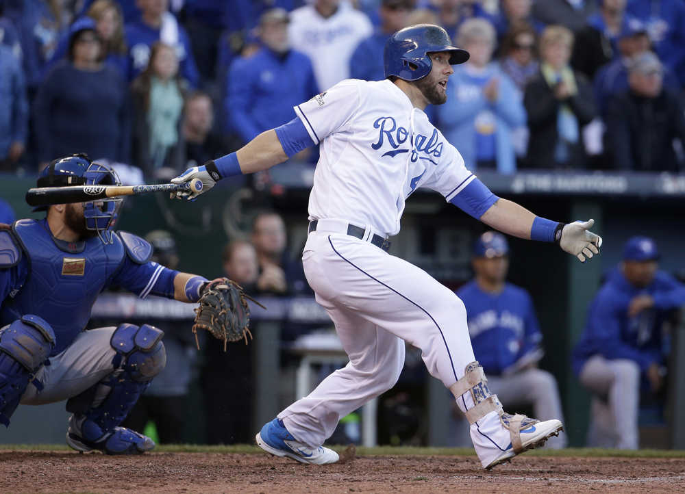Kansas City Royals' Alex Gordon hits an RBI double against the Toronto Blue Jays during the seventh inning in Game 2 of baseball's American League Championship Series against the Toronto Blue Jays on Saturday, Oct. 17, 2015, in Kansas City, Mo. (AP Photo/Charlie Riedel)