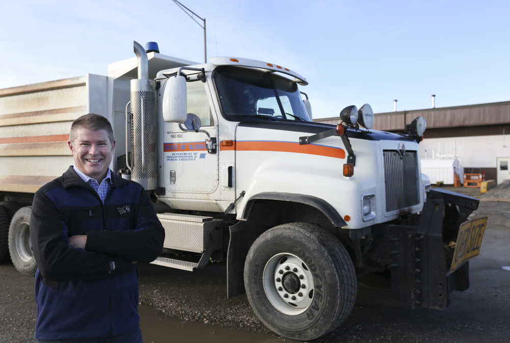 In this photo taken on Oct. 8, Dan Schacher, the maintenance superintendent for the Department of Transportation in Fairbanks, poses in front of a plow truck at the DOT.