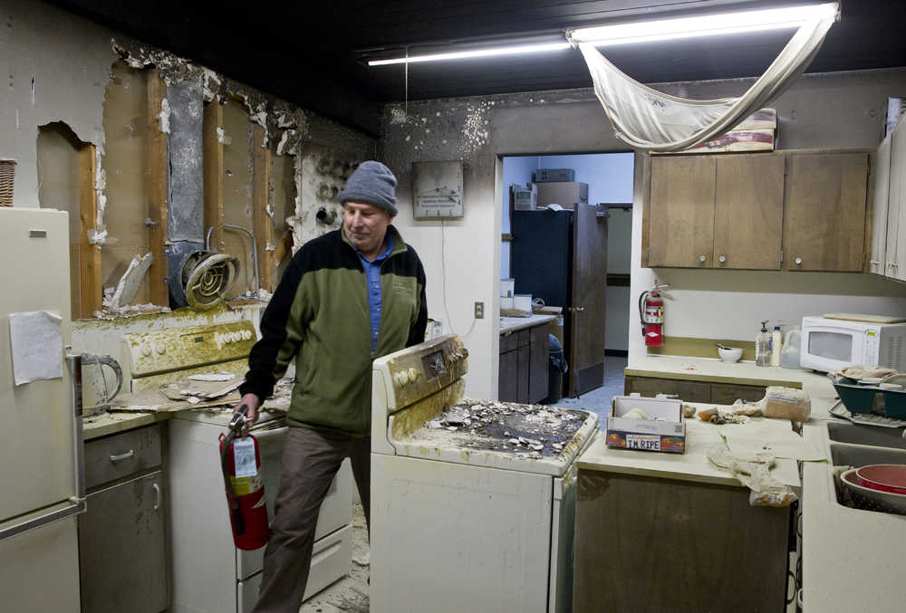 Bill Meier, a trustee of Faith Lutheran Church, walks through the church's kitchen Tuesday afternoon after a cooking fire. Capital City Fire/Rescue estimated the church sustained $40,000 worth of damage.