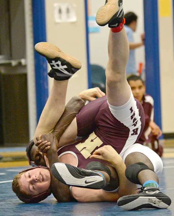 Hoonah's Manny Budke works a cradle on Ketchikan's Nate Eisenhower in a 132-pound match during last year's Brandon Pilot Invitational.
