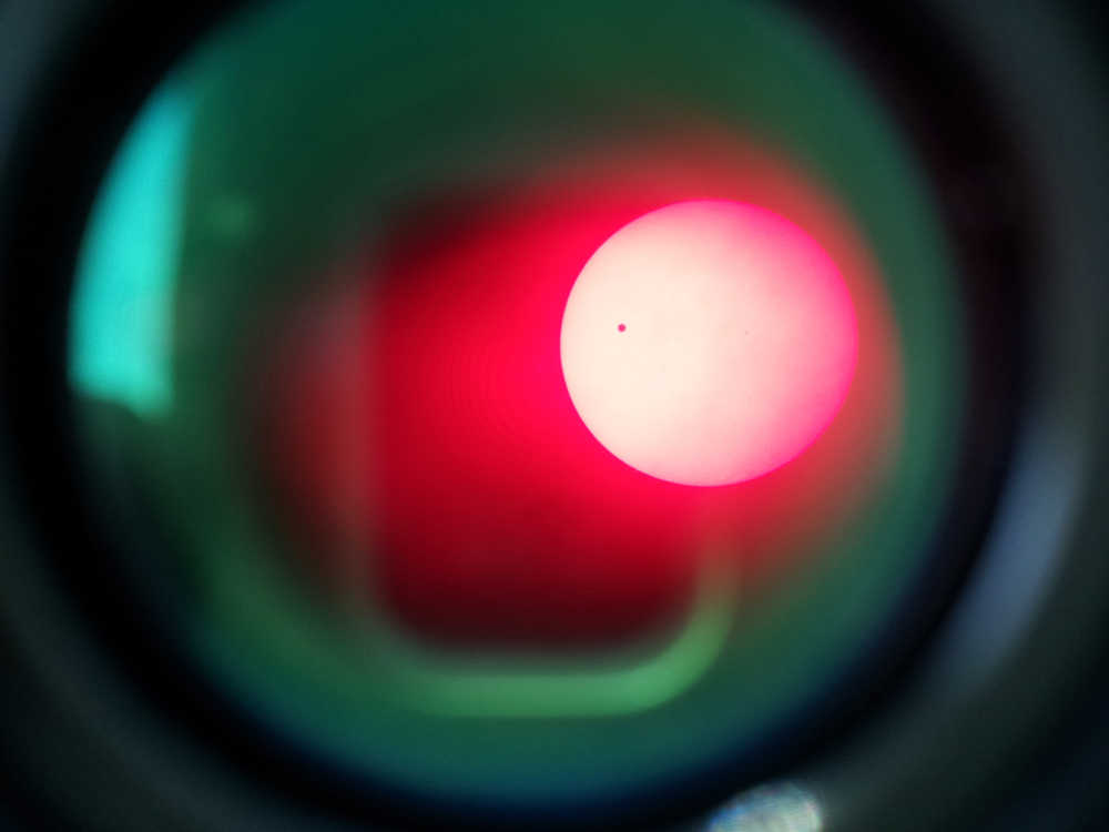 Venus transits the sun as seen from the Anchorage Museum in 2012.