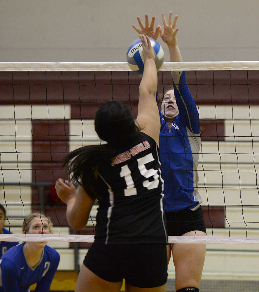 Juneau-Douglas' Soana Kelepi (15) and Thunder Mountain's Makayla Harp go for a ball during the All Comers Volleyball Tournament at Juneau-Douglas on Saturday. A slideshow of photos is online at juneauempire.com.
