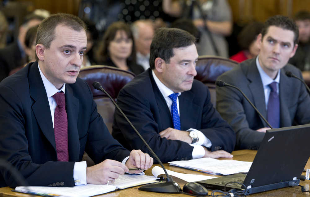 Consultants Radislov Shipkoff, director of Greengate LLC, left, Steven Kantor, managing director of FirstSouthwest, and Justin Palfreyman, director of Lazard, speak in favor of Gov. Bill Walker's TransCanada buy-out proposal during a House Finance Committee hearing at the Capitol on Saturday.