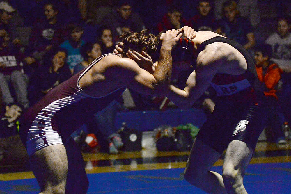 Ketchikan senior Nate Fousel and Juneau-Douglas junior Cody Weldon battle in the Brandon Pilot Invitational Wrestling Tournament at Thunder Mountain High School on Saturday. Fousel won by decision. A slideshow of tournament photos is online at juneauempire.com