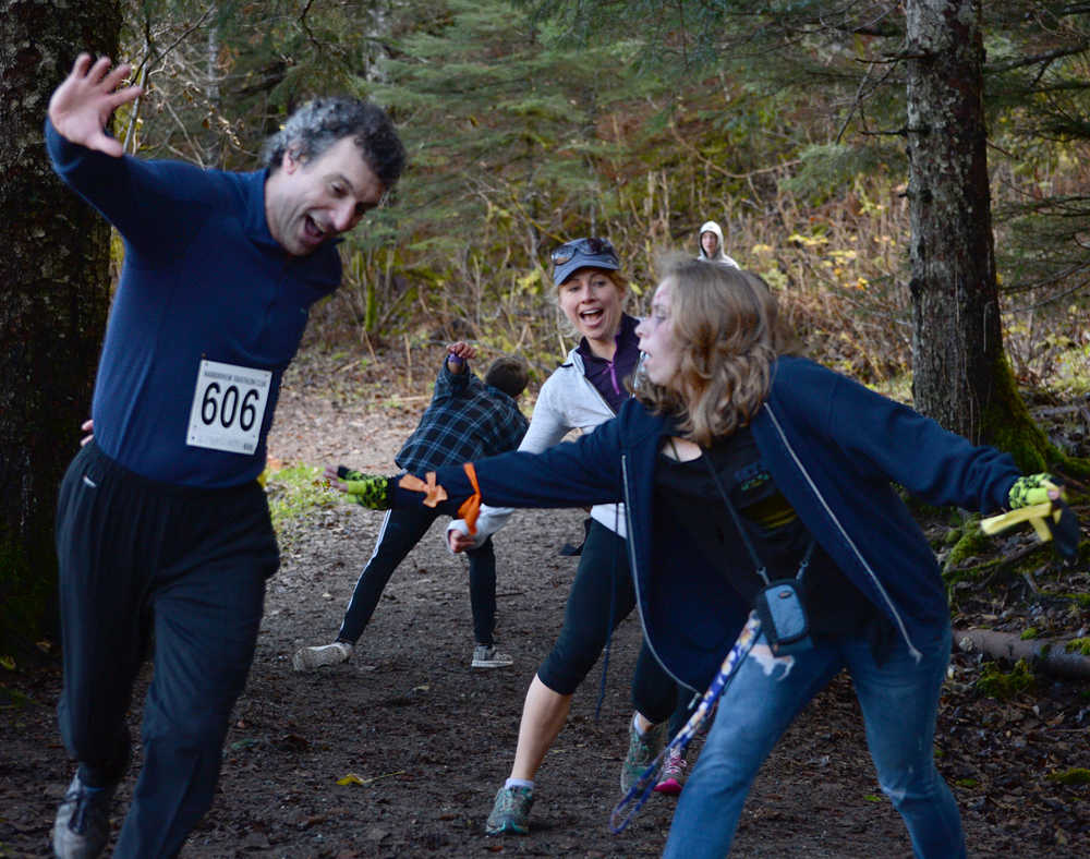Runners navigate through zombie-infected trails during Sunday's 4th Annual Zombie Run 5K or 1-mile run on the Treadwell Trails at Sandy Beach. The event was a fundraiser for the Harborview Elementary Triathlon Club.