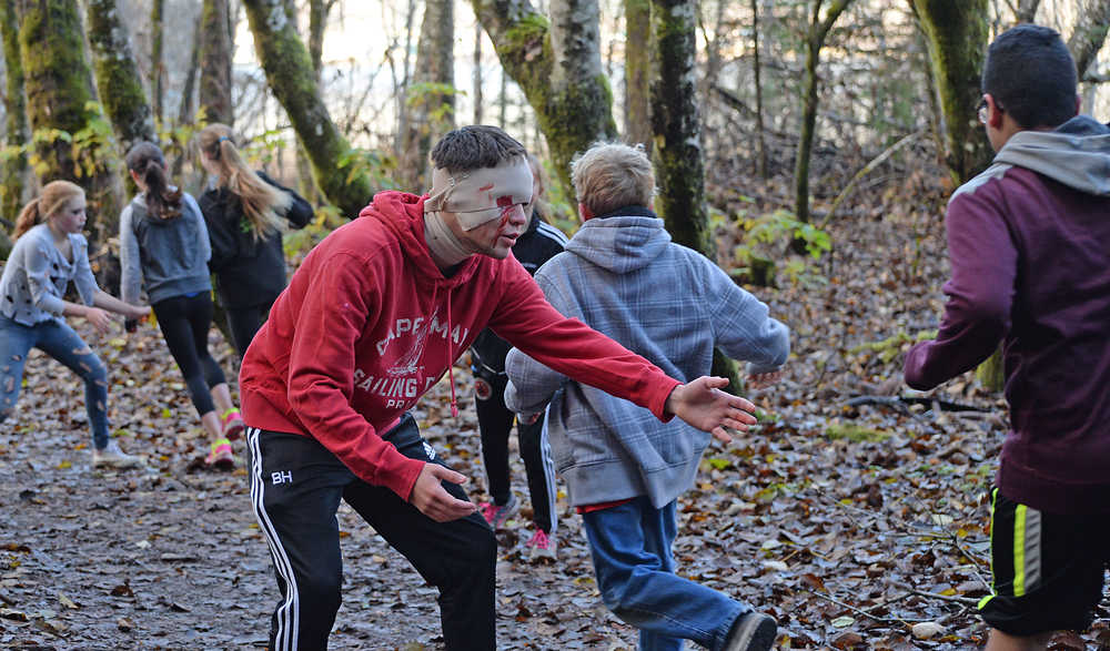 A zombie searches for brains during Sunday's 4th Annual Zombie Run 5K or 1-mile run on the Treadwell Trails at Sandy Beach. The event was a fundraiser for the Harborview Elementary Triathlon Club.