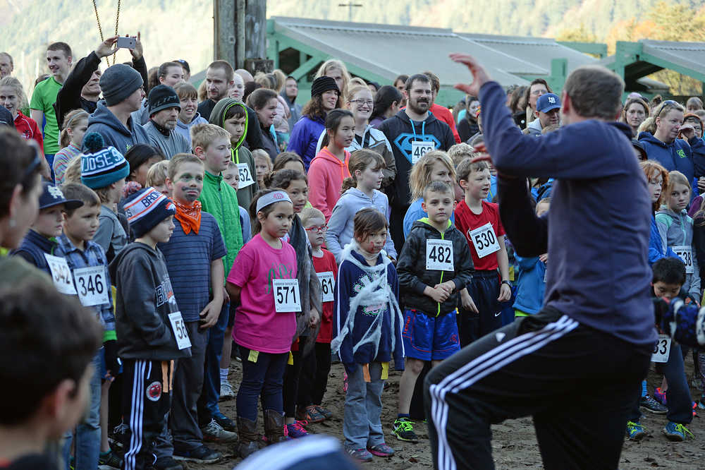 Locals watch as Harborview Elementary School physical education teacher Zach Stenson leads a Michael Jackson "Thriller" dance during Sunday's 4th Annual Zombie Run 5K or 1-mile run on the Treadwell Trails at Sandy Beach. The event was a fundraiser for the Harborview Elementary Triathlon Club.