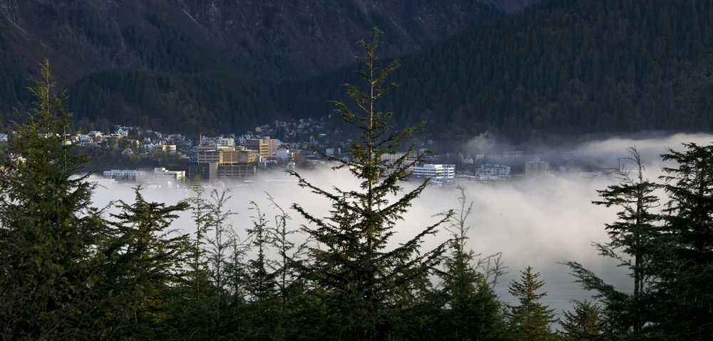 Low fog lingers over Gastineau Channel in front of downtown Juneau on Tuesday. Rain is the forecasted through Friday.