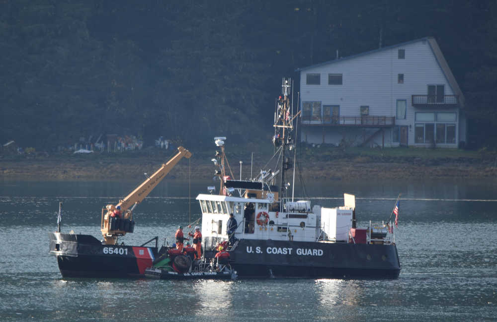 The U.S. Coast Guard buoy tender Elderberry takes aboard navigation markers from Gastineau Channel on Tuesday morning, Oct. 27, 2015. Each winter, the markers are removed from the channel to protect them from damage during ice and winter storms. The markers are reinstalled in the spring.