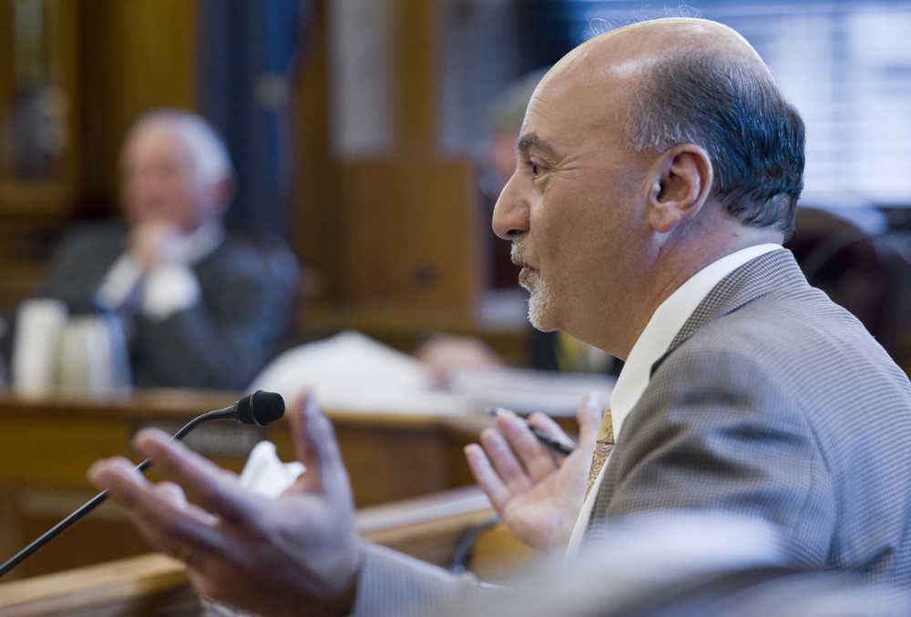 Rep. Les Gara, D-Anchorage, asks a question of Vincent Lee, director of Major Projects Development for TransCanada, about a proposed gasline buyout by the state to the House Finance Committee at the Capitol on Wednesday.