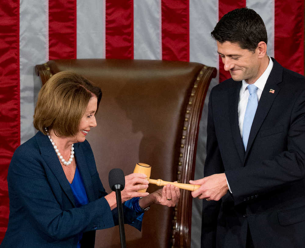 Newly elected House Speaker Paul Ryan of Wis., receives the Speaker's gavel from House Minority Leader Nancy Pelosi of Calif., in the House Chamber on Capitol Hill in Washington, Thursday, Oct. 29, 2015. Republicans rallied behind Ryan to elect him the House's 54th speaker on Thursday as a splintered GOP turned to the youthful but battle-tested lawmaker to mend its self-inflicted wounds and craft a conservative message to woo voters in next year's elections. (AP Photo/Andrew Harnik)