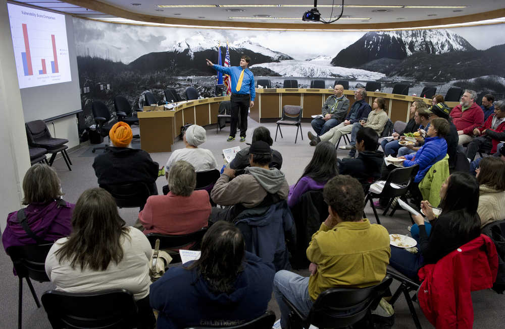 Brian Wilson, a research analyst for the Alaska Mental Health Board, speaks to Juneau residents attending a lunch meeting on the city's homeless vulnerability index in the Assembly chambers on Monday.