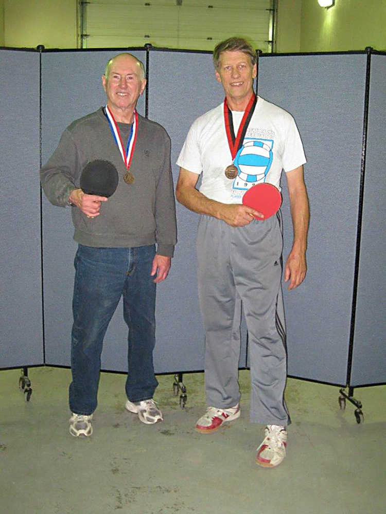 Bob Janes and Tim Mcleod with their men's doubles bronze medals from the Huntsman Senior Games.