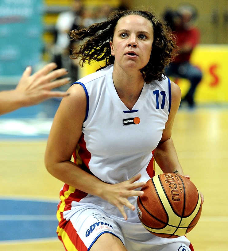 Talisa Rhea is shown playing for Lotos Gdynia in a women's professional basketball game in Poland in 2012. Rhea is now the Manager of Basketball Operations for the WNBA Seattle Storm.