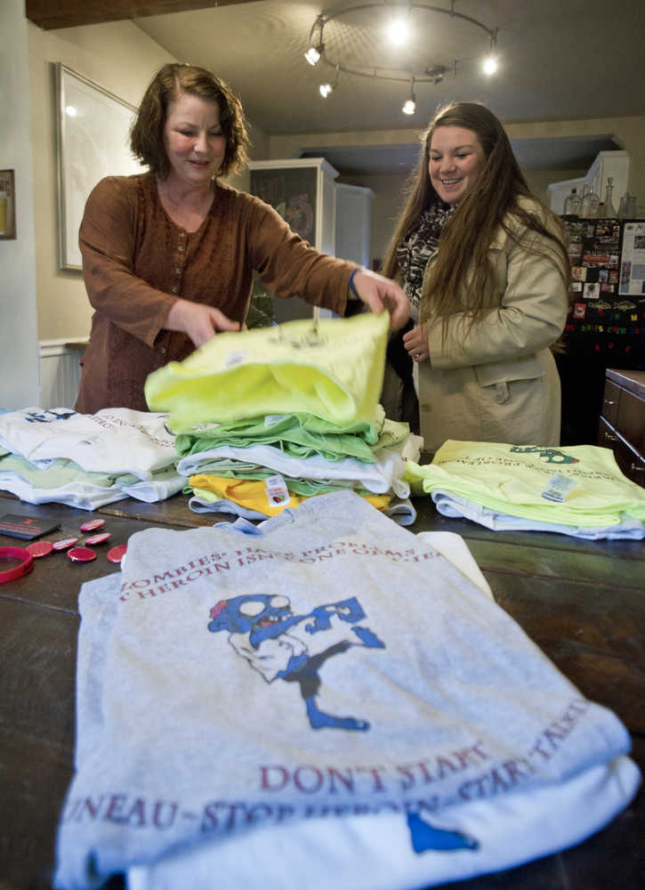 Michele Stuart Morgan, left, and Taelyn Coffee have created a grass-roots movement called "Juneau - Stop Heroin, Start Talking," bring awareness of heroin addiction in the capital city. The group has launched a public awareness campaign by handing out anti-heroin stickers, magnets and bracelets for free and selling T-shirts for a $10 donation.