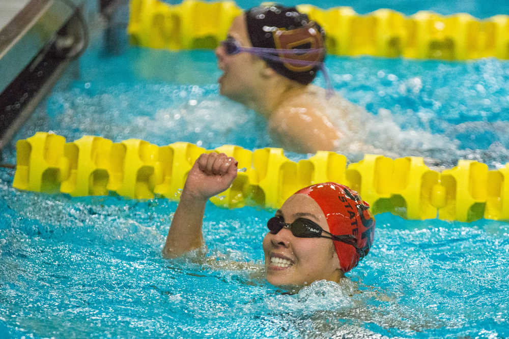 Juneau-Douglas' Mia Ruffin celebrates after winning the 200 yard IM at the State Swimming and Diving Championships Saturday, November 7, 2015 at Bartlett High School.