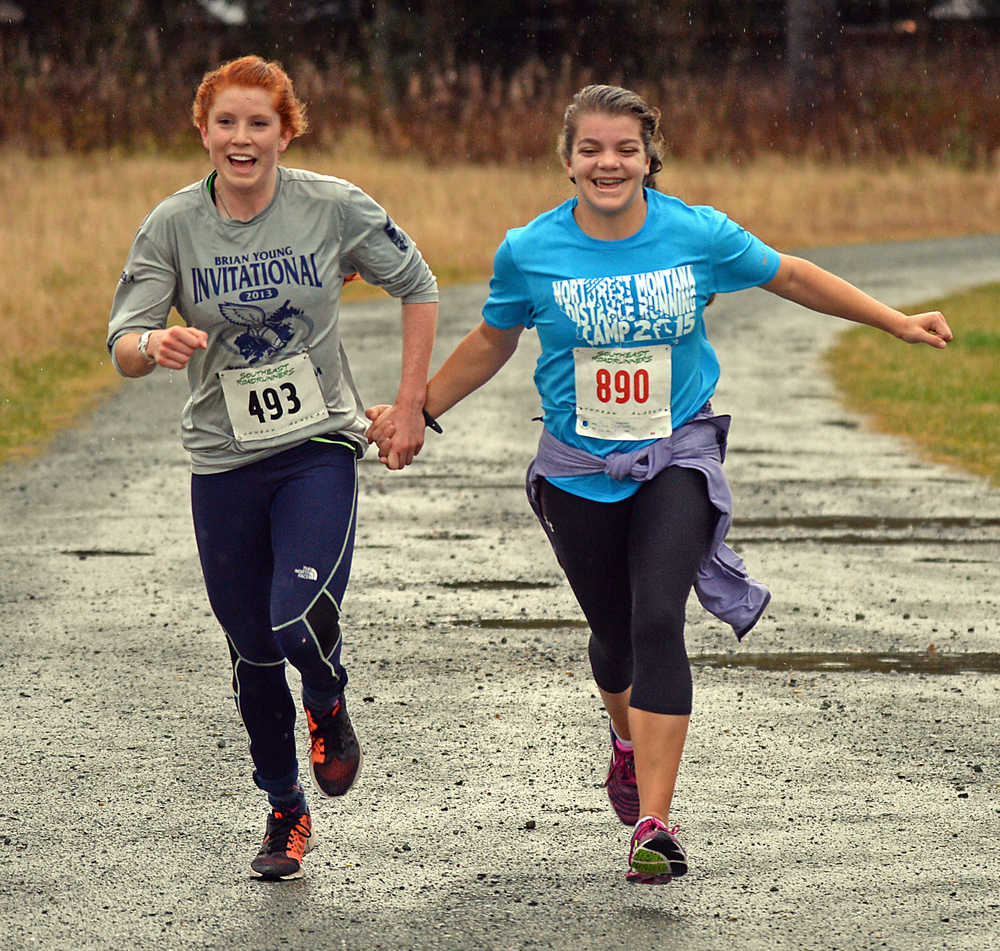 Top female finishers Naomi Welling, age 17, and Erin Wallace, age 14, finish in a tie at Saturday's Veterans Day Run. A slideshow of photos is at juneauempire.com.