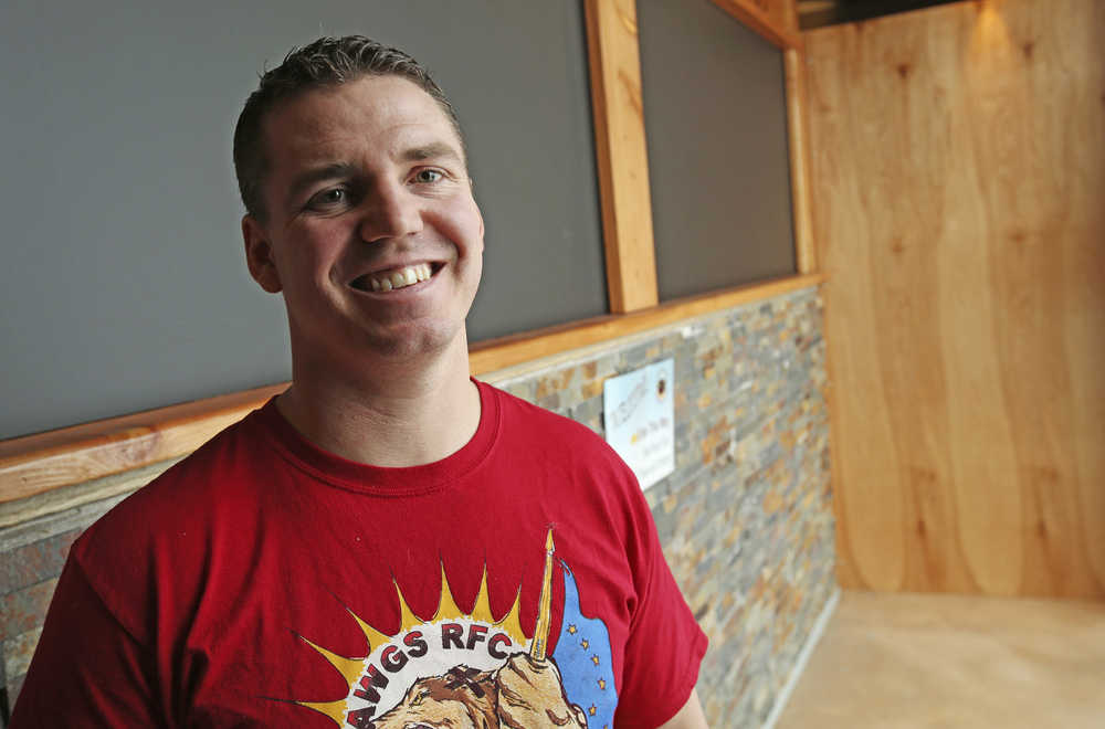 In this Oct. 29 photo, Brandon Emmett, a search and rescue medic, pot advocate and a Governor-appointed member of the Alaska State Marijuana Control Board, poses in Fairbanks. Emmett was recruited into the 2014 marijuana legalization movement by a friend. They won the vote in Alaska, and now he is a cannabis industry representative on the state Marijuana Control Board.