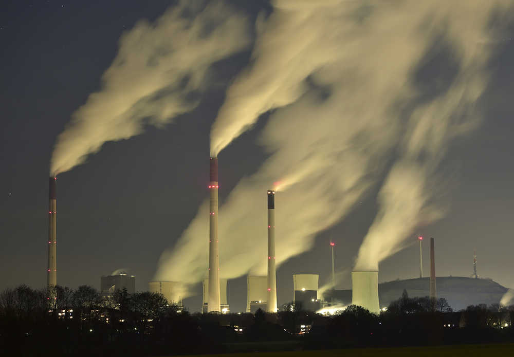 In this Nov. 24, 2014  photo, smoke streams from the chimneys of the E.ON coal-fired power station in Gelsenkirchen, Germany.