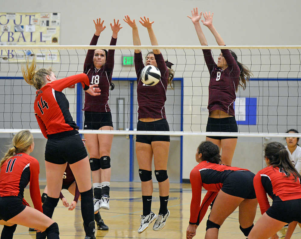 Ketchikan's Kreylynn Johnson (18), Gabby Clark and Kaia Michalsen (8) block Juneau-Douglas' Maddie McKeown (14) during the 4A Region V volleyball championship last weekend at Thunder Mountain High School in Juneau. Kayhi will open the 3A/4A ASAA/First National Bank Alaska state tournament at 10 a.m. today against South High School at the Alaska Airlines Center in Anchorage.