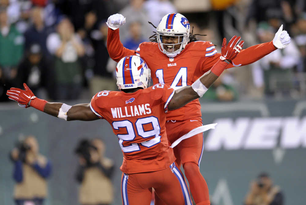 Buffalo Bills running back Karlos Williams, front, and wide receiver Sammy Watkins celebrate Williams' touchdown catch against the New York Jets during the second half of an NFL football game, Thursday, Nov. 12, 2015, in East Rutherford, N.J. (AP Photo/Bill Kostroun)