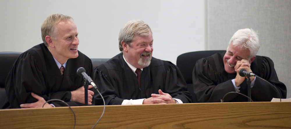 In this Nov. 30, 2011 photo, Juneau Superior Court Judge Phillip Pallenberg, left, shares a laugh with District Court Judge Thomas Nave, center, and Superior Court Judge Louis Menendez, during Menendez's swearing-in ceremony at the Dimond Courthouse. Pallenberg has put his name forward for a judgeship on the Alaska Supreme Court.
