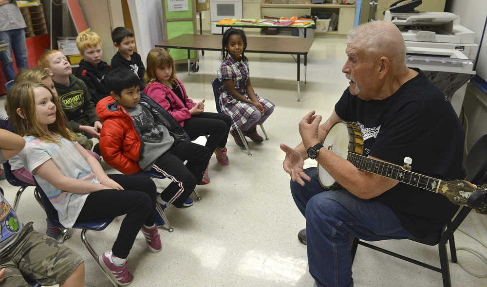 In this Nov. 4 photo, sea chanteyman Don Sineti talks to first-graders at Baranof Elementary School before a sing along during a visit to the school in Sitka. Sineti first came to Sitka in 1998 for the second year of WhaleFest, and has returned every year but one since then.