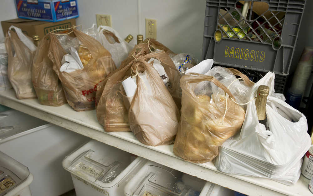 Food for about a dozen families for Thanksgiving sits on a shelf at The Glory Hole on Tuesday. The soup kitchen is asking for more donations.