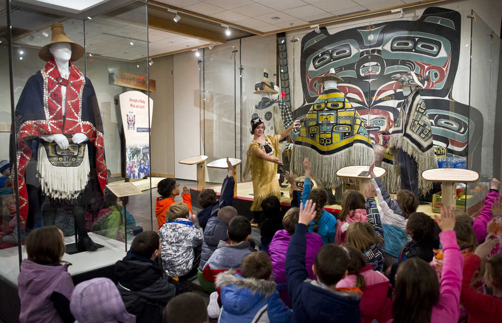 Tlingit weaver and teacher Lily Hope guides Auke Bay Elementary School second graders through the cultural exhibit in the Walter Soboleff Center on Thursday. The event is part of the Ensuring the Arts for Any Given Child program, which was founded by the Kennedy Center to create full access to arts education programs and resources for K-8 students. The Kennedy Center works with 18 sites in the country and Juneau is one of them. Starting in November, all second-grade students in the Juneau School District will go on annual arts excursions to the Walter Soboleff Building to learn about the Tlingit, Haida and Tsimshian cultures.