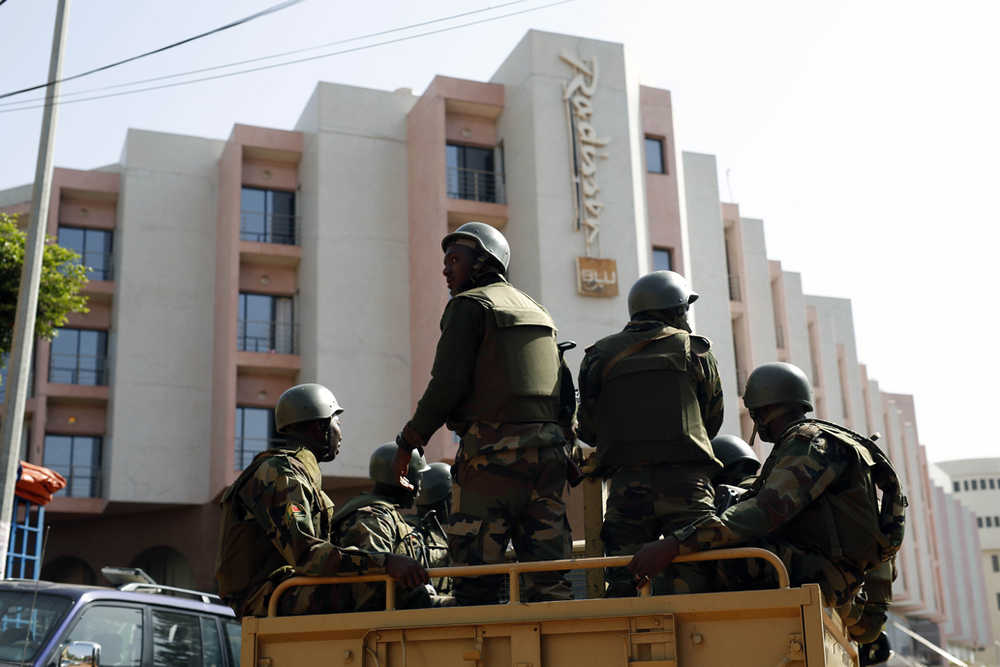 Soldiers from the presidential patrol outside the Radisson Blu hotel in Bamako, Mali, Saturday in anticipation of the President's visit.
