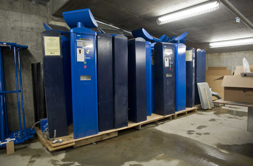 Two dozen parking vending machines sit in storage at the Downtown Transportation Center Parking Garage on Friday. The city is currently in litigation against Aparc over the system's failure.