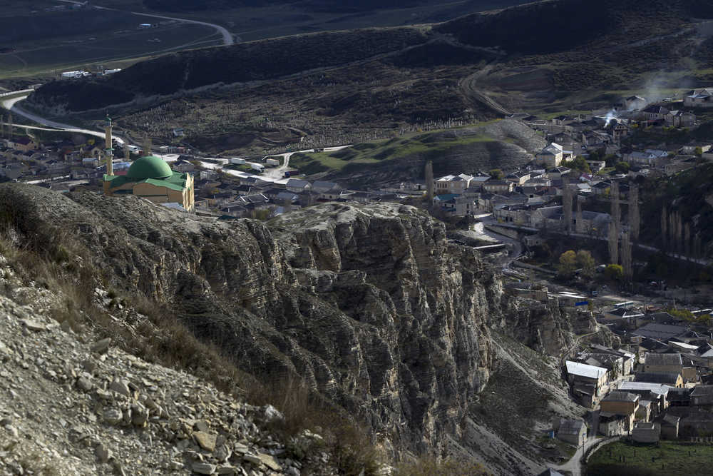 In this photo taken Nov. 12, a mosque is seen from the mountains in the village of Gubden, Dagestan, Russia.
