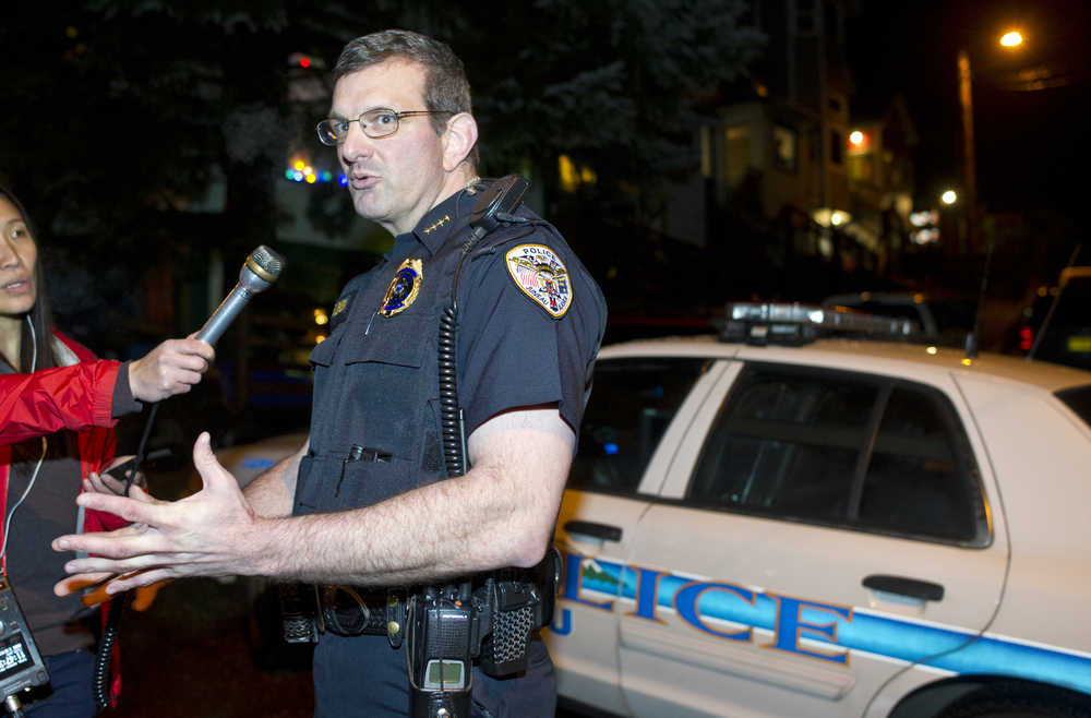 Juneau Police Chief Bryce Johnson speaks to reporters about the death of Mayor Greg Fisk on Kennedy Street Monday night.