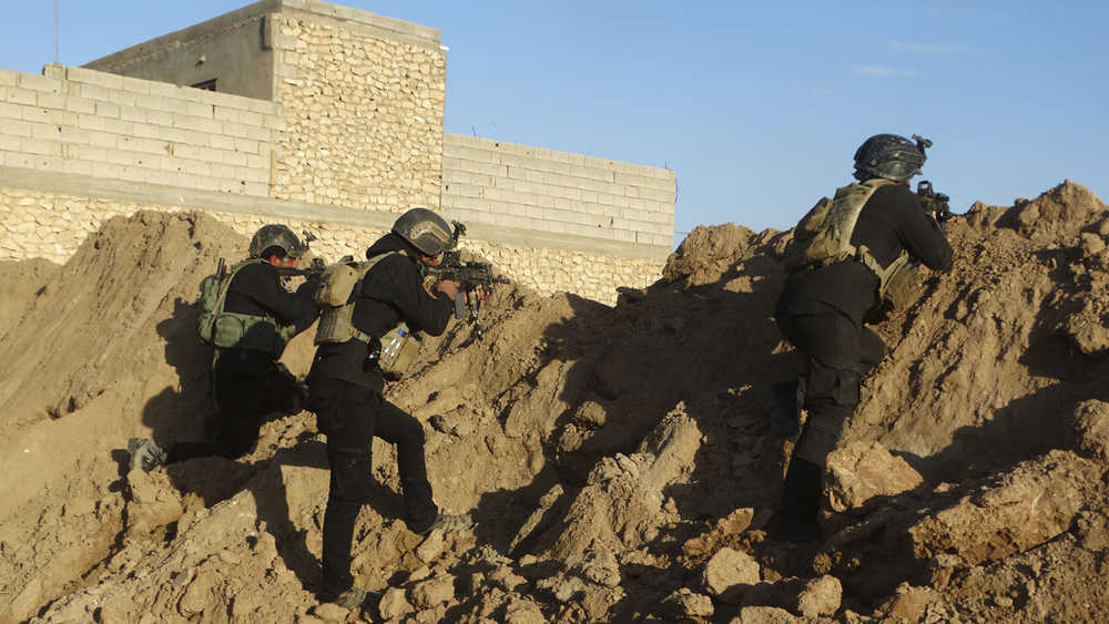 Iraqi security forces take combat position at the front-line against Islamic State group militants as they seek to retake Ramadi, the capital of Iraq's Anbar province, on Monday.