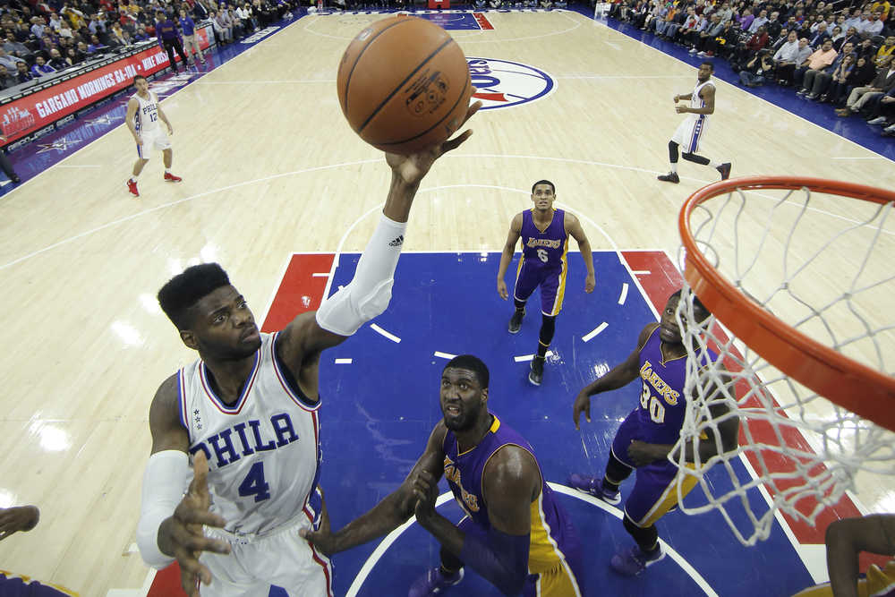 Philadelphia 76ers' Nerlens Noel goes up for a shot against Los Angeles Lakers' Roy Hibbert during the first half Tuesday in Philadelphia.