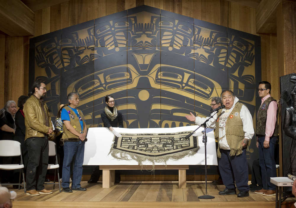 David Katzeek, second from right, speaks during a public ceremony at the Walter Soboleff Center Tuesday for the return of a Chilkat robe recently acquired on eBay. Sealaska Heritage Institute purchased the robe in November from eBay seller George Blucker of Texas who willingly took a loss on the sale so the piece could be repatriated to the Tlingit, Haida and Tsimshian.