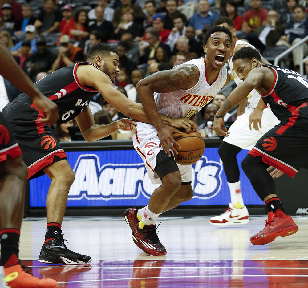 Atlanta Hawks guard Jeff Teague loses the ball as he drives against Toronto Raptors guard Cory Joseph during the first half Wednesday in Atlanta.