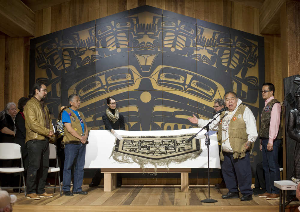 David Katzeek, second from right, speaks during a public ceremony at the Walter Soboleff Center Dec. 1 for the return of a Chilkat robe recently acquired on eBay. Sealaska Heritage Institute purchased the robe in November from eBay seller George Blucker of Texas who willingly took a loss on the sale so the piece could be repatriated to the Tlingit, Haida and Tsimshian.