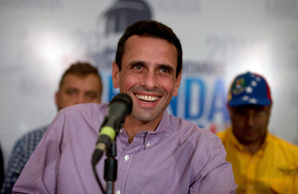 Leader of opposition party Primero Justicia, Henrique Capriles, who's also governor of Miranda state, gives a press conference at his office in Caracas, Venezuela, Monday.