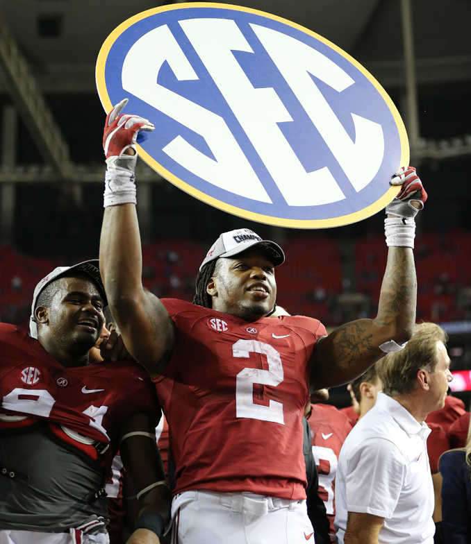 Alabama running back Derrick Henry celebrates after winning the Southeastern Conference championship on Saturday.