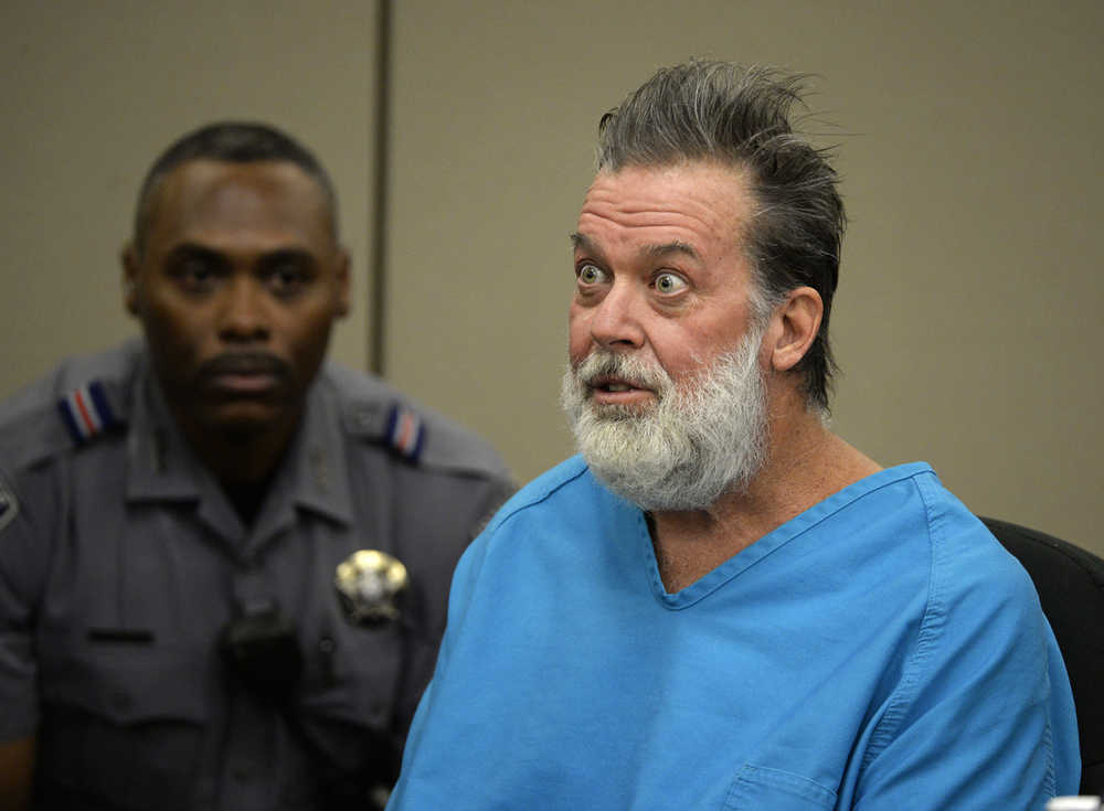 Robert Lewis Dear talks to Judge Gilbert Martinez during a court appearance on Wednesday, Dec. 9, 2015, in Colorado Springs, Colo. Dear, accused of killing three people and wounding nine others at a Colorado Springs Planned Parenthood clinic on Nov. 27, was charged with first-degree murder. (Andy Cross/The Denver Post via AP, Pool)