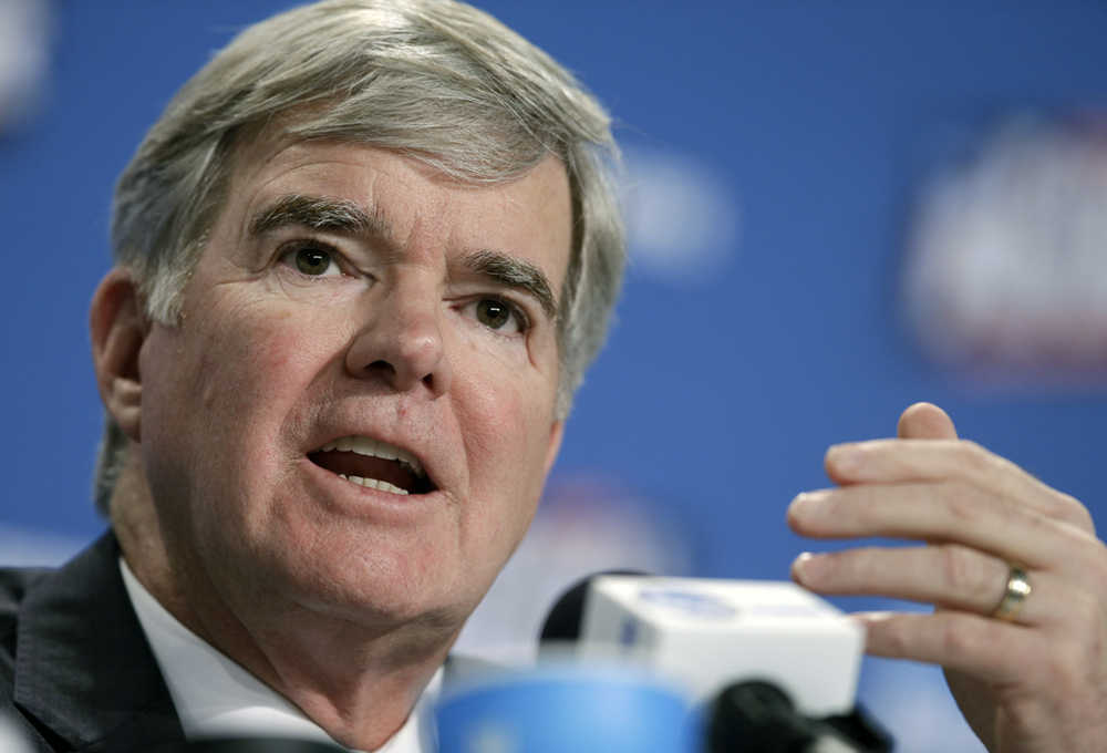 In this April 2 photo, NCAA President Mark Emmert answers questions during a news conference in Indianapolis. "The members are going to have to figure out, what's the purpose of bowl games?" NCAA President Mark Emmert told reporters Wednesday.