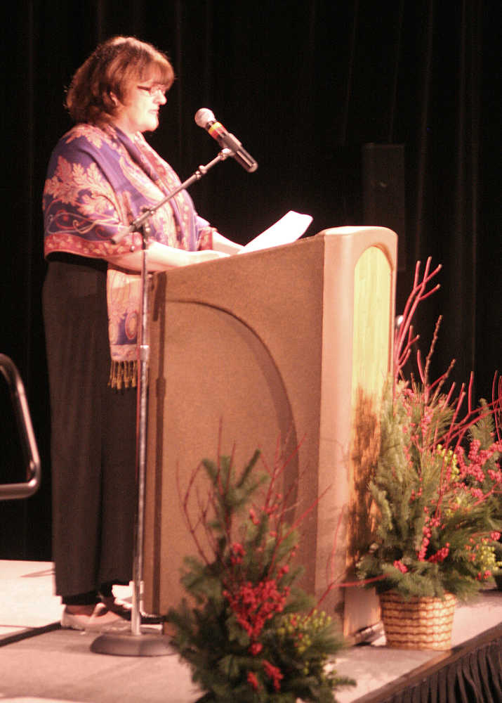 Claire Richardson addresses a full crowd Sunday during the celebration of life of late Juneau Mayor Stephen "Greg" Fisk held at Centennial Hall. Richardson, a friend and neighbor to Fisk, served as master of ceremony.