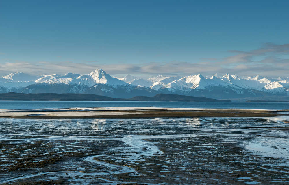 Snow-capped mountains viewed from Eagle Beach.