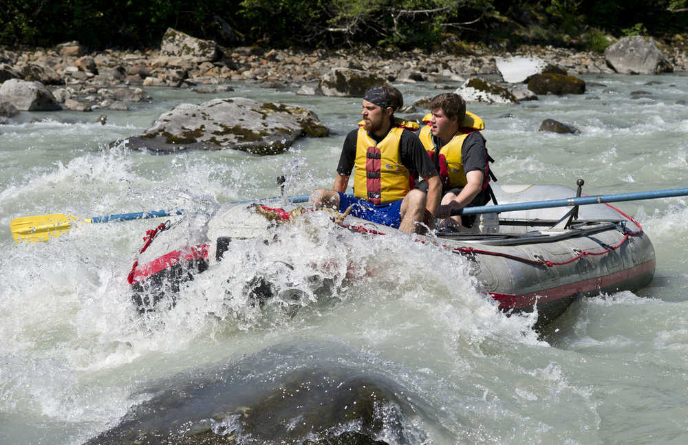 River guides with Alaska Travel Adventures take a practice run through rapids on the Mendenhall River.
